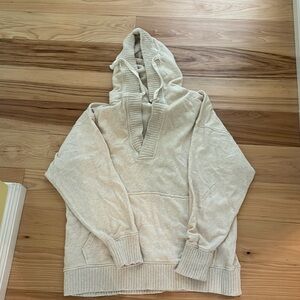 Oversized pullover v-neck oatmeal color sweatshirt.